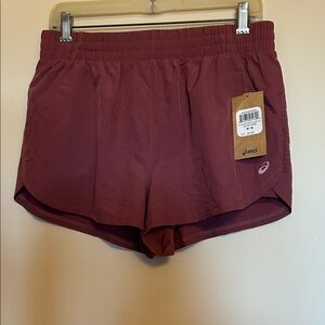 Asics dusty rose polyester/spandex athletic shorts  elastic waist size M….NWT